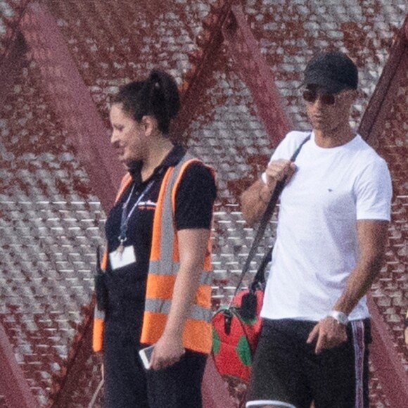 Exclusif - Cristiano Ronaldo, sa compagne Georgina Rodriguez et ses enfants Alana Martina dos Santos Aveiro, Cristiano Jr, Eva Maria Dos Santos, Mateo Ronaldo embarquent dans un jet privé après avoir passé une semaine au dans l'hôtel cinq étoiles Westin Resort Costa Navarino, à l'aéroport de Kalamata en Grèce, le 18 juin 2019.