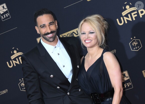 Adil Rami et Pamela Anderson au photocall de la 28ème cérémonie des trophées UNFP (Union nationale des footballeurs professionnels) au Pavillon d'Armenonville à Paris, France, le 19 mai 2019. © Coadic Guirec/Bestimage