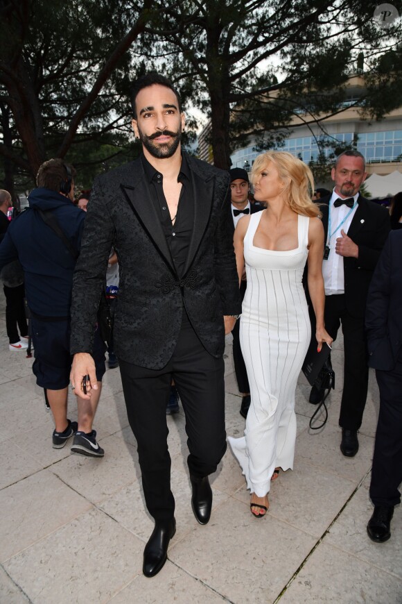 Pamela Anderson et Adil Rami lors de la soirée Amber Lounge Monaco 2019 au profit de la fondation de Jackie Stewart "Race Against Dementia" à l'hôtel Méridien Beach Plaza à Monaco, le 24 mai 2019. © Bruno Bebert / Bestimage