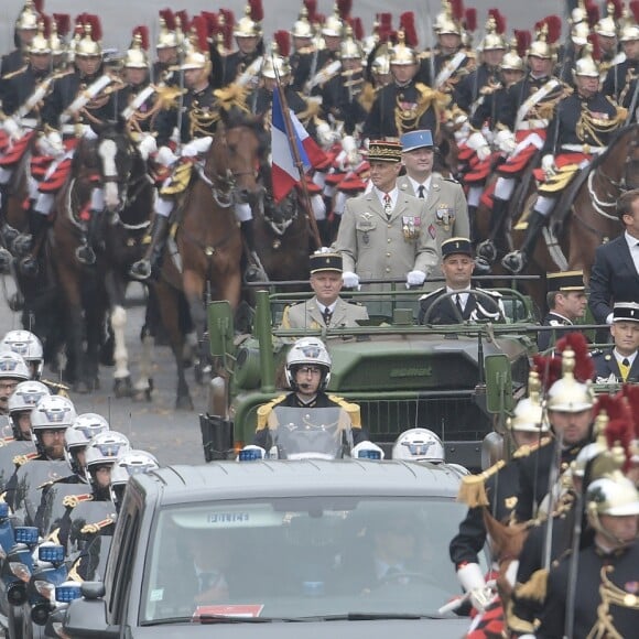 Emmanuel Macron, président de la République Française, descend les Champs-Elysées au côté du Général François Lecointre (chef d'État-Major des armées) à bord d'un Camion ACMAT VLRA, afin de rejoindre la tribune présidentielle et assister au défilé militaire du 14 juillet. Paris, le 14 juillet 2019. © Lemouton-Gorassini-Perusseau/Bestimage