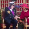 Le prince Laurent de Belgique au téléphone en pleine parade militaire - et sa femme la princesse Claire qui lui demande de raccrocher - lors de la Fête nationale belge, le 21 juillet 2019 à Bruxelles...