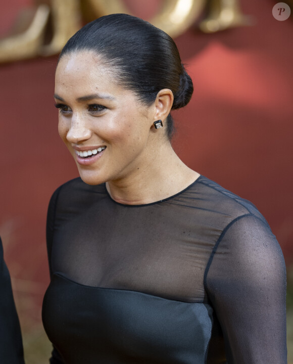 Le prince Harry, duc de Sussex, et Meghan Markle, duchesse de Sussex, à la première du film "Le Roi Lion" au cinéma Odeon Luxe Leicester Square à Londres, le 14 juillet 2019.