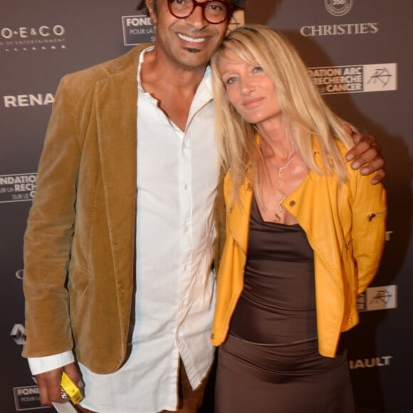 Exclusif - No Web - Yannick Noah et sa femme Isabelle Camus lors du dîner de la fondation ARC au restaurant de l'hôtel The Peninsula à Paris le 10 octobre 2016. Première fondation française 100% dédiée à la recherche sur le cancer, la Fondation ARC a affecté en effet les recettes de l'édition 2016 autour d’un ambitieux projet de recherche contre les cancers du sein « triple négatifs », particulièrement agressifs et difficiles à soigner. "Nous sommes aujourd'hui en position de changer les prescriptions thérapeutiques pour les cancers du sein les plus agressifs. La recherche a en effet désormais accès aux informations moléculaires à l'origine de chaque développement cancéreux : cela ouvre des possibilités inédites." déclare Jean-Yves Blay, directeur du centre Léon Berard, conseiller du Président du Conseil Scientifique de la Fondation ARC. Avant le dîner, Monsieur Lambert Wilson a remis un chèque de 50 000 euros à la Fondation ARC au nom de RENAULT, grand mécène de la soirée. Puis ce fut au tour de Mademoiselle Michèle Laroque d’offrir la recette du spectacle « Ils s’aiment » interprété avec Mademoiselle Muriel Robin le 24 Octobre prochain au théâtre de Paris (grâce au soutien de Venteprivée.com). En fin de soirée, Laurent Weil a annoncé le montant total de la collecte : 370 000 euros pour lutter contre le cancer du sein. © Rachid Bellak / Bestimage  No Web/No blog pour Belgique/Suisse10/10/2016 - Paris