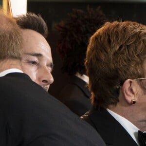 Le prince Harry, duc de Sussex, et Meghan Markle, duchesse de Sussex, avec Elton John et son mari David Furnish à la première du film "Le Roi Lion" au cinéma Odeon Luxe Leicester Square à Londres, le 14 juillet 2019.