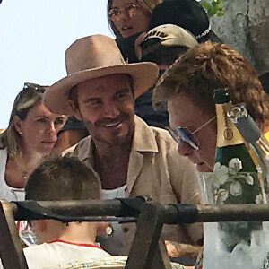 Exclusif - David Beckham avec sa femme Victoria Beckham et leurs enfants Brooklyn, Romeo, Cruz et Harper en vacances avec Elton John, son mari David Furnish et leurs fils Elijah et Zachary sont allés déjeuner au restaurant La Guerite sur l'île Ile Sainte Marguerite en France, le 24 août 2019