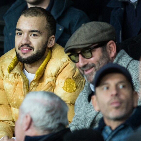 Oli (Olivio Ordonez) et Kad Merad dans les tribunes lors du match de Ligue 1 "PSG - OM (4-0)" au Parc des Princes, le 27 octobre 2019. © Cyril Moreau/Bestimage