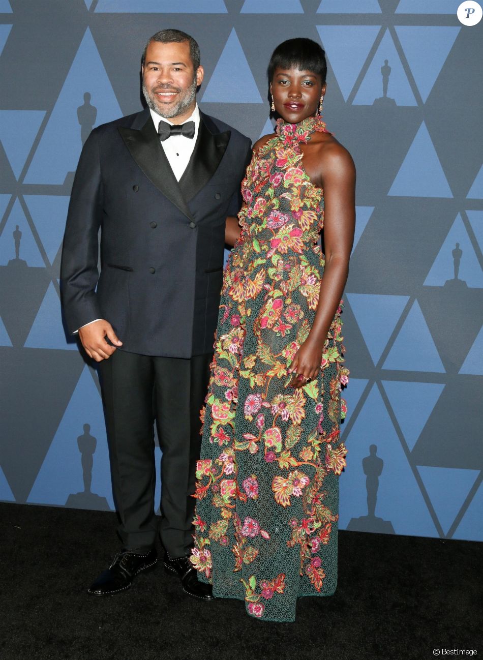 Lupita Nyong o Et Son Mari Lupita Nyong'o et Jordan Peele au photocall de la 11ème édition des Annual  Governors Awards au Hollywood & Highland Center à Los Angeles, le 27  octobre 2019 - Purepeople