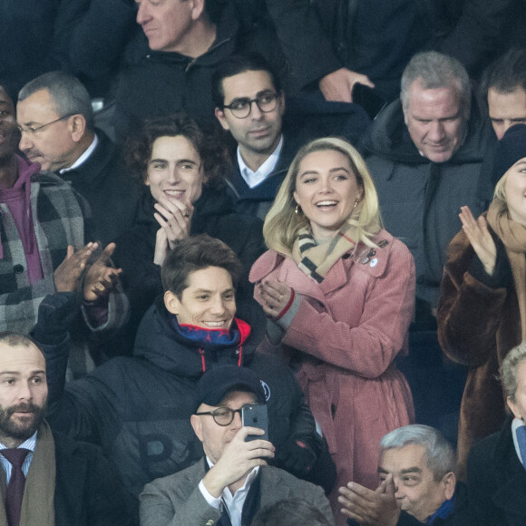 Stéphane Bak, Timothée Chalamet, Florence Pugh, Saoirse Ronan dans les tribunes lors du match de Champions League "PSG - Galatasaray (5-0)" au Parc des Princes à Paris, le 11 décembre 2019. © Cyril Moreau/Bestimage