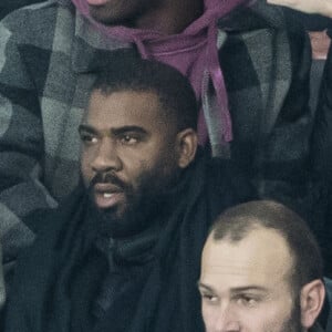 Stéphane Bak, Timothée Chalamet, Florence Pugh dans les tribunes lors du match de Champions League "PSG - Galatasaray (5-0)" au Parc des Princes à Paris, le 11 décembre 2019. © Cyril Moreau/Bestimage