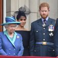 La reine Elisabeth II d'Angleterre, Meghan Markle, duchesse de Sussex (habillée en Dior Haute Couture par Maria Grazia Chiuri), le prince Harry, duc de Sussex - La famille royale d'Angleterre lors de la parade aérienne de la RAF pour le centième anniversaire au palais de Buckingham à Londres. Le 10 juillet 2018
