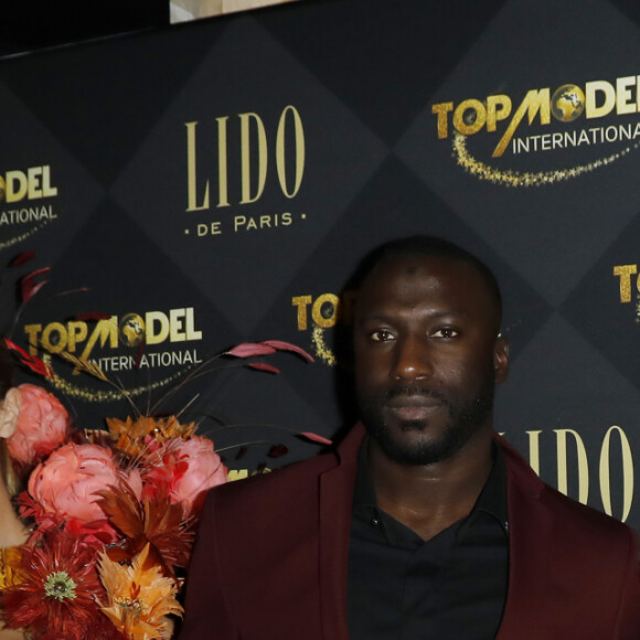 L'acteur Moussa Mansaly et Maëva Coucke (Miss France 2018) lors du photocall de la soirée de la grande finale du concours Top Model International au Lido à Paris, France, le 19 janvier 2020. © Marc Ausset-Lacroix/Bestimage