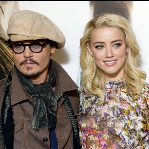 Johnny Depp et Amber Heard au photocall du film "Rhum Express" à Paris.