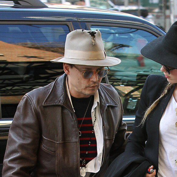Johnny Depp et sa fiancée Amber Heard arrivent à leur hôtel à New York, le 21 avril 2014.