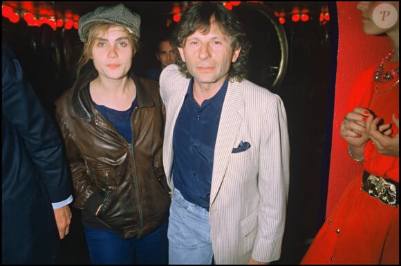 Emmanuelle Seigner et Roman Polanski en soirée à Paris en 1986.