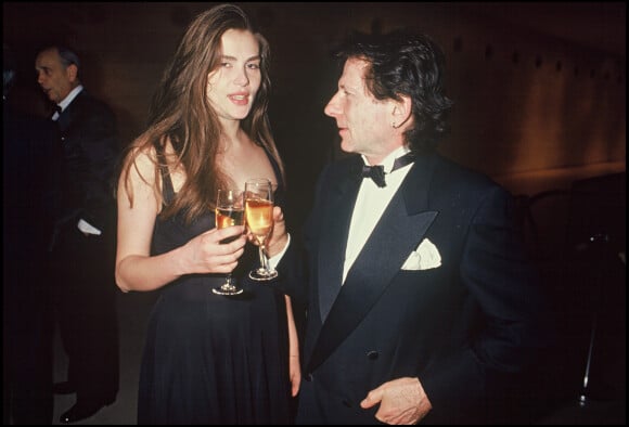 Emmanuelle Seigner et Roman Polanski en soirée en 1993.