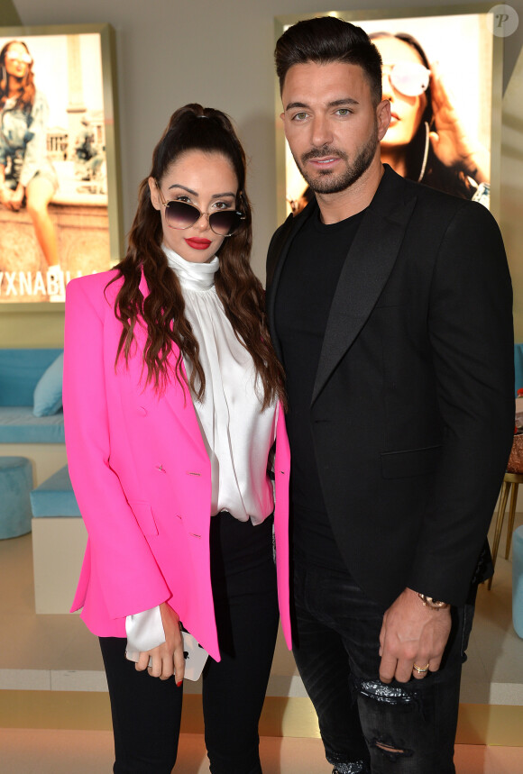 Nabilla Benattia (enceinte) et son mari Thomas Vergara - Nabilla Benattia présente sa collaboration pour les lunettes Quay Australia sur la plage Magnun lors du 72ème Festival International du Film de Cannes, le 18 mai 2019. ©Veeren / Bestimage