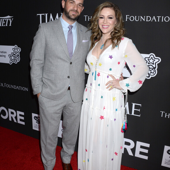 Alyssa Milano et son mari Dave Bugliari au photocall du 10e anniversaire du gala caritatif "Core" à Los Angeles, le 15 janvier 2020.