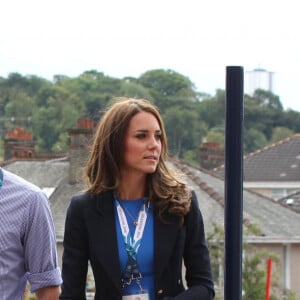 Le prince Harry, le prince William, le duc de Cambridge et Catherine Kate Middleton, la duchesse de Cambridge vont voir des épreuves d'athlétisme au stade Hampden Park lors des XXèmes Jeux du Commonwealth à Glasgow, le 29 juillet 2014.