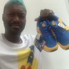 Djibril Cissé, heureux propriétaire des nouvelles baskets Lidl. Juillet 2020.
