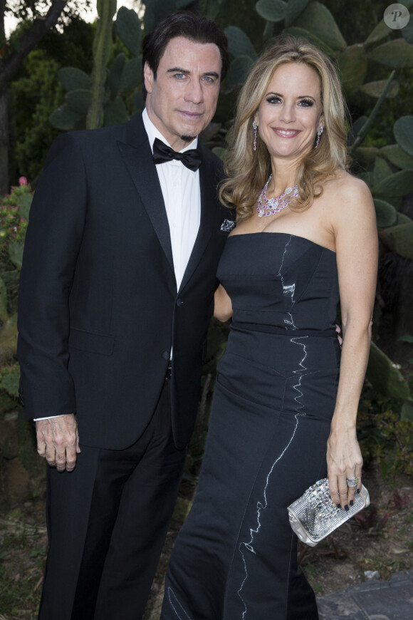 John Travolta et sa femme Kelly Preston - Soirée "Puerto Azul Experience" lors du 67e festival de Cannes le 21 mai 2014.