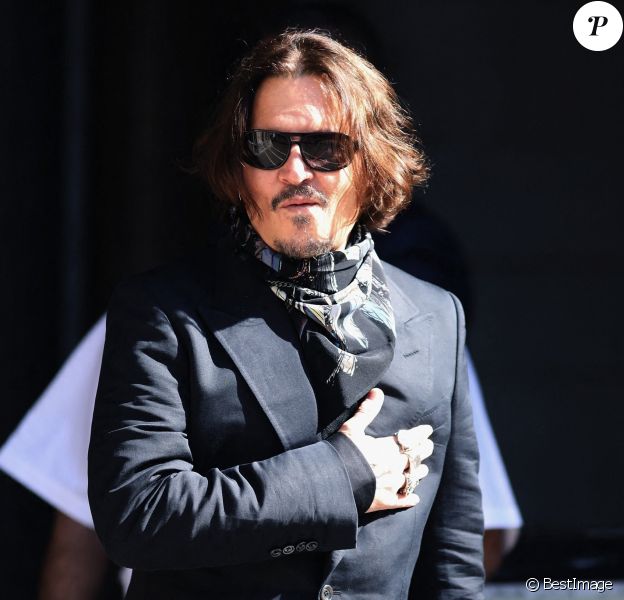 Johnny Depp, souriant, arrive à la cour royale de justice à Londres, pour le procès en diffamation contre le magazine The Sun Newspaper. Le 20 juillet 2020