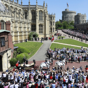 Le prince Harry, duc de Sussex, et Meghan Markle, duchesse de Sussex, lors de leur mariage au château de Windsor, Royaume Uni, le 19 mai 2018.