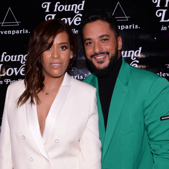 Exclusif - Amel Bent et Slimane (Slimane Nebchi) lors de la soirée Eleven Paris x Amel Bent: I found love in a hopeful place (J'ai trouvé l'amour dans un endroit plein d'espoir) au bar de nuit musical L'Orphée (7 rue Fontaine) dans le 9ème arrondissement de Paris, France, le 25 février 2020. A l'inverse de Rihanna, Eleven Paris x Amel Bent tombent amoureux dans un endroit rempli d'espoir, Paris. L'idée de cette collaboration va plus loin que ce que l'on pense, car elle ne nous conte pas le début d'une idylle romanesque comme on pourrait s'y attendre mais l'histoire d'amour de chaque parisien ou banlieusard vit avec un quartier incontournable de Paris. Pour Amel Bent, ce coup de foudre opéré loin du triangle d'or et des fantasmes du touriste lama. Il commence dans les années 80, dans les bras de sa mère, arpentant le boulevard Barbès dans un brouhaha tourbillonnant, galvanisé par l'odeur du tabac et des marrons qui grillent à la sortie du métro, c'est la visite courageusement inoubliable, entre amis, d'un sex-shop à Pigalle ou encore un fou rire insolent, avec un Drag nommée Mariah rencontrée à 4h du matin, dans un bar du Marais. L'histoirepeut continuer, dans Belleville, devant un restaurant où Mohamed et Joseph mangent une brick presqu'aussibonne que celle de leurs mè!res. Ou ce jour où elle a poussé la porte d'un salon de coiffure bondé de Château d'eau pour y faire ses premières tresses, oui... tomber amoureux , c'est aussi les heures perdues à sillonner la Gare du Nord, passage obligé pour quitter ou rejoindre sa Courneuve natale, en attendant un train ou ses amis, bien-sûr, toujours en retard. Cette collaboration surprenante, nous donne enfin l'occasion de porter et brandir fièrement le vrai Paris, celui qu'on aime tant et de le partager au plus grand nombre. Maintenant, dites-nous, where did you find love? (où as-tu trouvé l'amour?). © Rachid Bellak/Bestimage 
