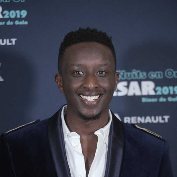 Ahmed Sylla - Photocall du 9ème dîner de gala des Nuits En Or 2019 à l'Unesco à Paris, le 17 juin 2019. Soutien du projet depuis de nombreuses années, l'UNESCO accueille l'ensemble des réalisatrices et réalisateurs lors de ce Dîner de Gala. C'est l'occasion de mettre en lumière la richesse et la diversité culturelle de ce programme réunissant des films de tous horizons, comme 35 regards posés sur le monde, symboles de dialogue et d'ouverture. Pour marquer cette soirée et leur participation à la Tournée, l'Académie des César remet à chaque réalisatrice et réalisateur, une médaille réalisée spécialement chaque année par la Monnaie de Paris. © Giancarlo Gorassini/Bestimage 