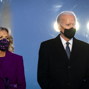 U.S. President-elect Joe Biden, right, and wife Jill Biden, wear protective masks while standing at the Lincoln Memorial Reflecting Pool during a Covid-19 memorial to lives lost on the National Mall in Washington, DC on Tuesday, January 19, 2021. Biden arrived in Washington on the eve of his inauguration with the usual backdrop of celebrations and political comity replaced by a military lockdown. Photo by Al Drago/UPI /ABACAPRESS.COM 