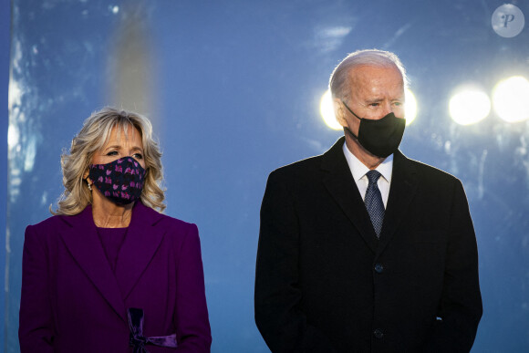 U.S. President-elect Joe Biden, right, and wife Jill Biden, wear protective masks while standing at the Lincoln Memorial Reflecting Pool during a Covid-19 memorial to lives lost on the National Mall in Washington, DC on Tuesday, January 19, 2021. Biden arrived in Washington on the eve of his inauguration with the usual backdrop of celebrations and political comity replaced by a military lockdown. Photo by Al Drago/UPI /ABACAPRESS.COM 