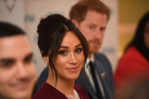 Le prince Harry, duc de Sussex, et Meghan Markle, duchesse de Sussex, participent à une réunion sur l'égalité des genres avec les membres du Queen's Commonwealth Trust (dont elle est vice-présidente) et du sommet One Young World au château de Windsor, le 25 octobre 2019.