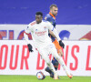 Sinaly Diomande (en maillot blanc) lors du match de football en ligue 1 Lyon - Montpellier à Lyon le 13 février 2021. © JB Autissier/Panoramic/Bestimage
