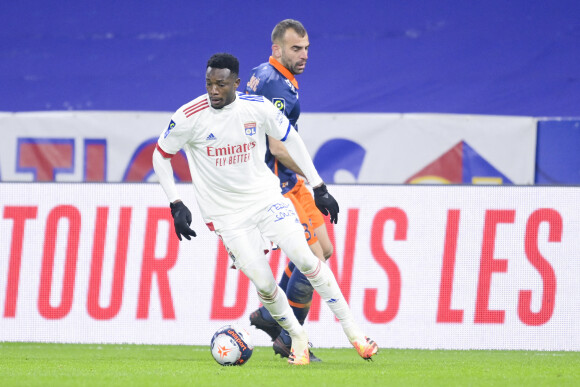 Sinaly Diomande (en maillot blanc) lors du match de football en ligue 1 Lyon - Montpellier à Lyon le 13 février 2021. © JB Autissier/Panoramic/Bestimage