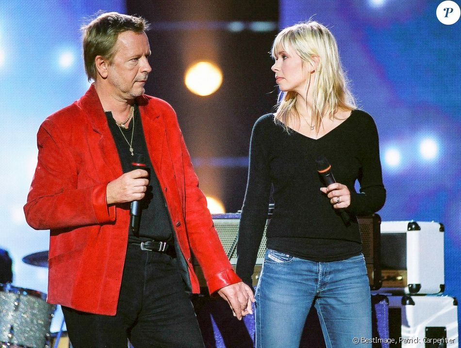 Le chanteur Renaud et sa femme Romane Serda en concert pour les 20 ans du Zenith de Paris en 2005. © Patrick Carpentier / Bestimage