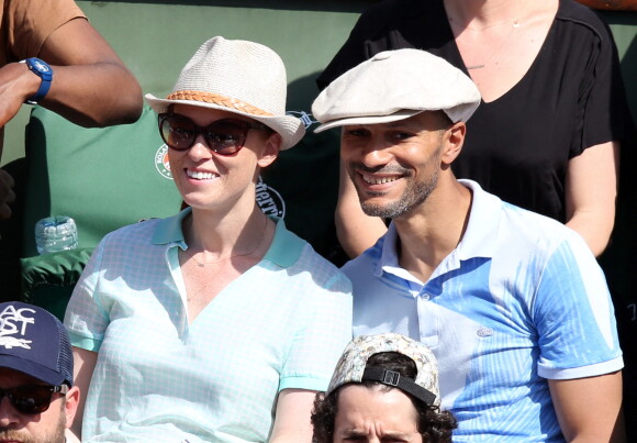 Audrey Fleurot et Djibril Glissant assistent à la finale dame lors des Internationaux de France de tennis de Roland Garros à Paris le 7 juin 2014.