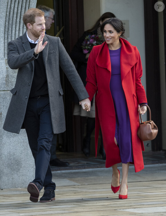 Le prince Harry, duc de Sussex, et Meghan Markle, duchesse de Sussex (enceinte de son fils Archie) lors d'une visite à Birkenhead le 14 janvier 2019.