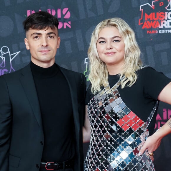 Louane Emera et son compagnon Florian Rossi posent à deux pour la première fois lors des NRJ Music Awards, à Paris.