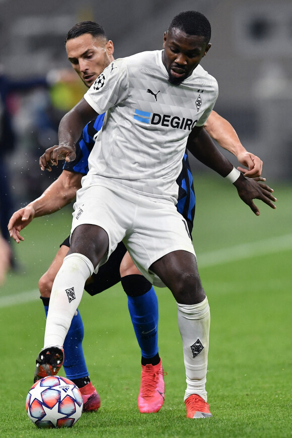 Marcus Thuram-Danilo D'Ambrosio - Match nul entre Milan et Borussia Mönchengladbach (2 - 2) en Ligue des Champions à Milan, le 22 octobre 2020. 