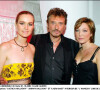Johnny Hallyday, son épouse Laeticia et sa fille Laura Smet en soirée en 2003.