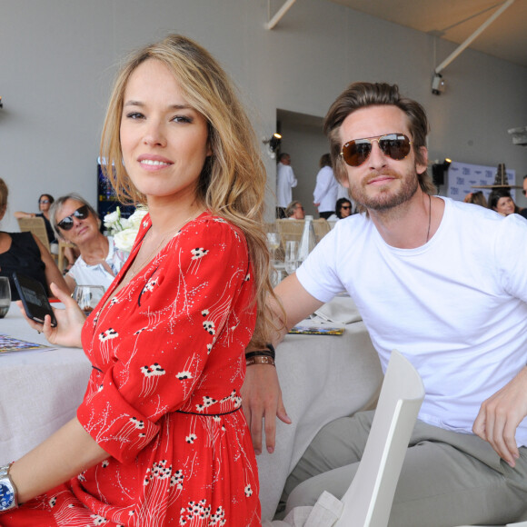 Exclusif - Philippe Lacheau et sa compagne Elodie Fontan au Longines Paris Eiffel Jumping au Champ de Mars à Paris, le , le 7 juillet 2019.