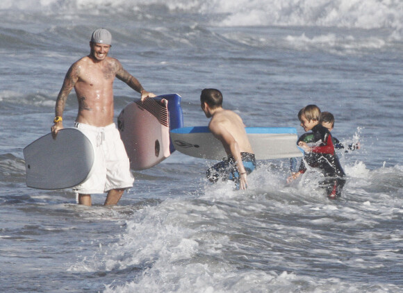 David Beckham et ses fils Brooklyn, Romeo et Cruz à Malibu, en août 2011.