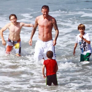 David Beckham et ses fils Brooklyn, Romeo et Cruz à Los Angeles, en juillet 2011.