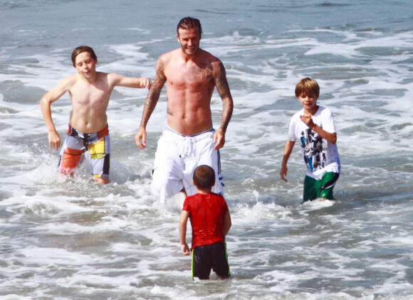 David Beckham et ses fils Brooklyn, Romeo et Cruz à Los Angeles, en juillet 2011.