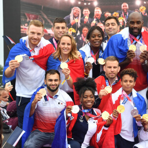 Teddy Riner et l'équipe de France olympique de judo (composée de Clarisse Agbegnenou, Madeleine Malonga, Romane Dicko, Sarah-Léonie Cysique, Amandine Buchard, Margaux Pinot, Axel Clerget, Alexandre Iddir et Guillaume Chaine) fêtent leur retour au Trocadéro à Paris, le 2 août 2021. © Veeren/Bestimage