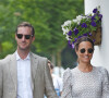 Pippa Middleton et son mari James Matthews se tiennent la main alors qu'ils arrivent au stade de Wimbledon à Londres.