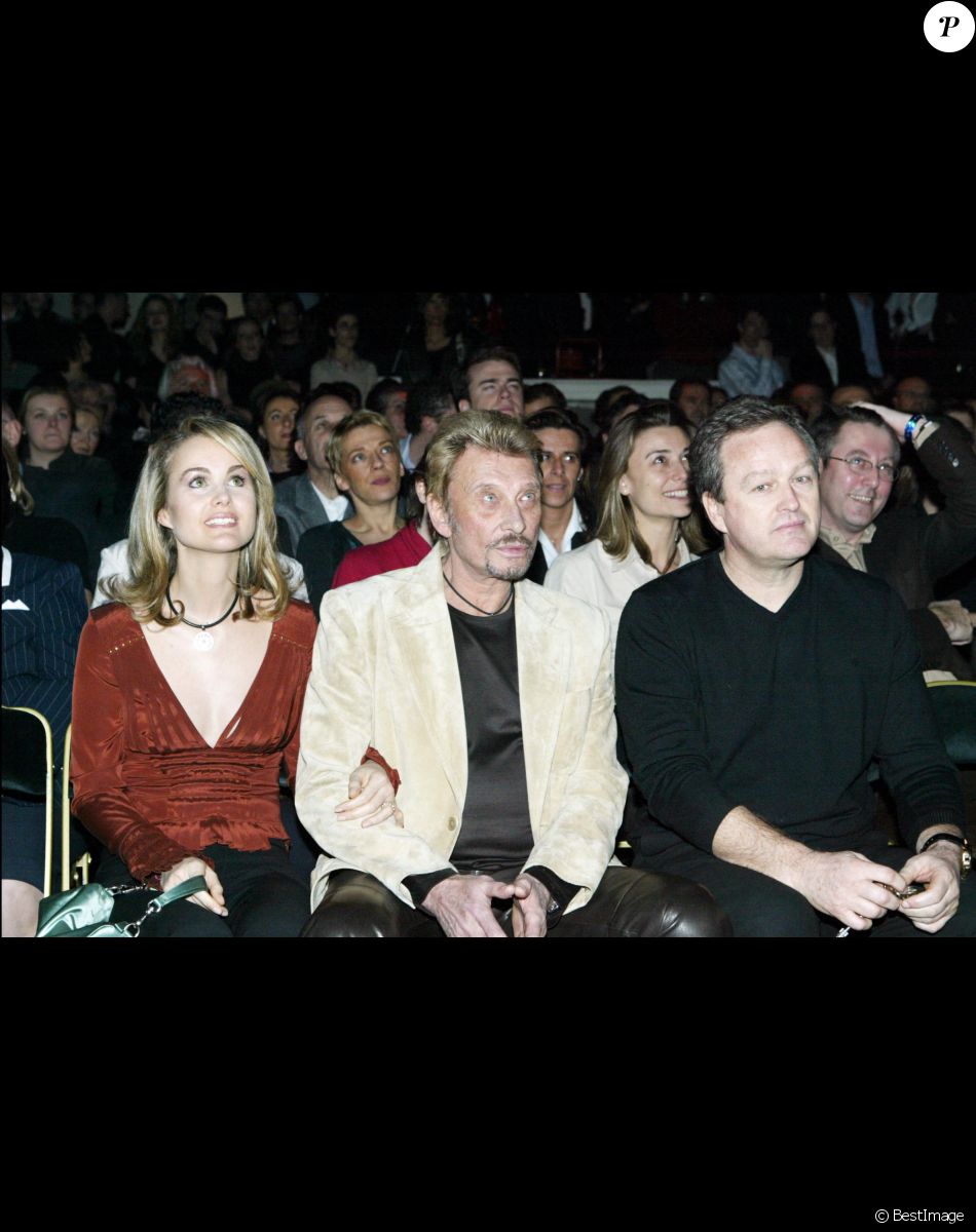 Johnny Hallyday, Laeticia et son père André Boudou au club l'Amnesia en 2004.
