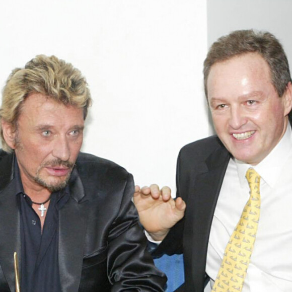 Johnny Hallyday, son épouse Laeticia et son père André Boudou à la Nuit des 7 d'Or à l'Amnesia en 2003. 