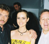 Johnny Hallyday, son épouse Laeticia et le père de celle-ci, André Boudou, à l'Amnesia en 2003. 
