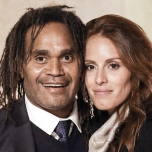 L'ancien footballeur français Christian Karembeu et sa femme Jacky Chamoun - Dîner au Palais de l'Elysée en l'honneur des 50 ans du Variétés Club de France, à Paris, le 14 octobre 2021. © Stéphane Lemouton / Bestimage