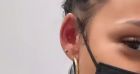 Christina Milian à Paris avec M. Pokora : elle s'ouvre une folie piercing, et montre tout